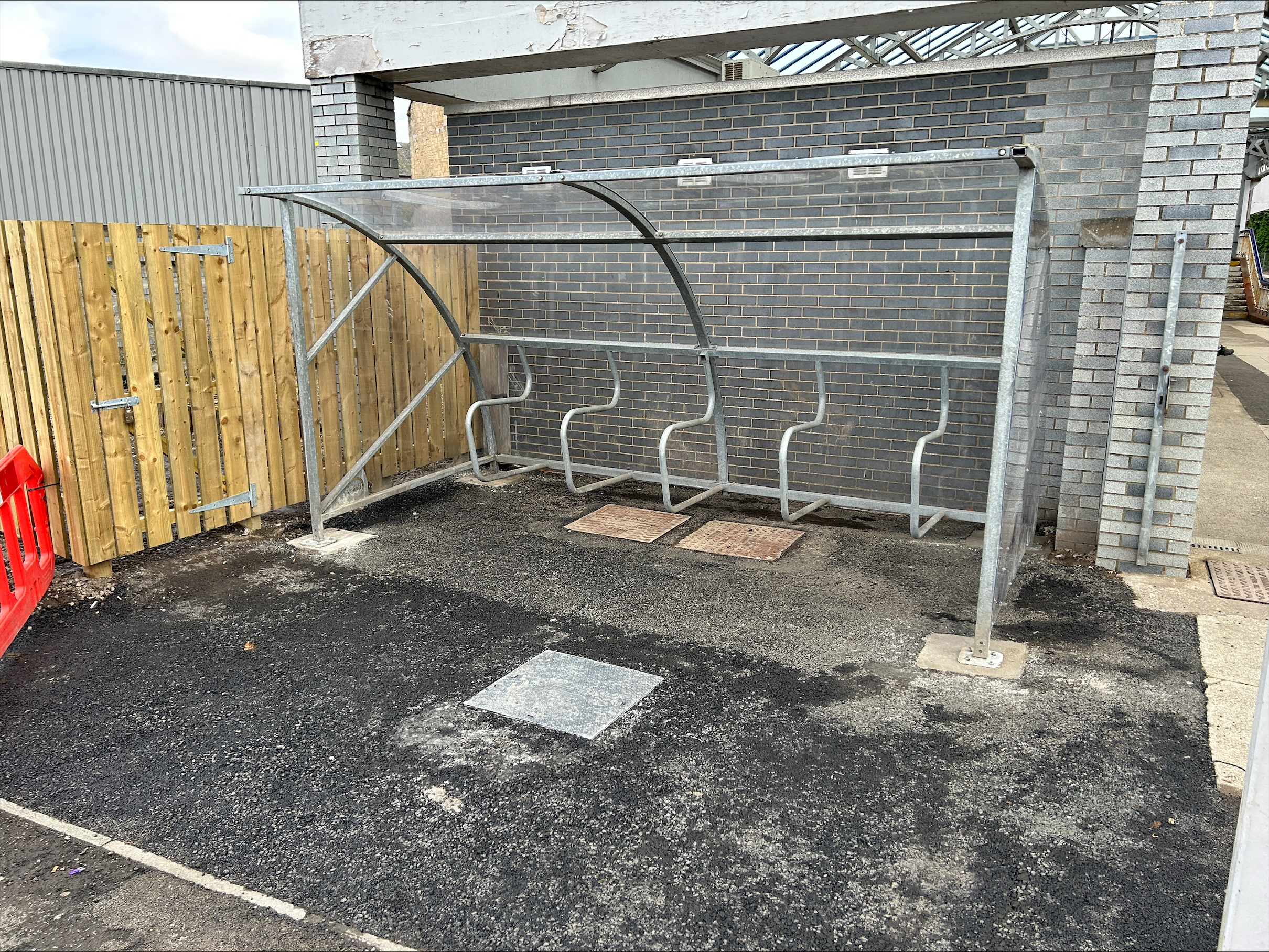 Bike shelter at Port Glasgow station relocated to new home